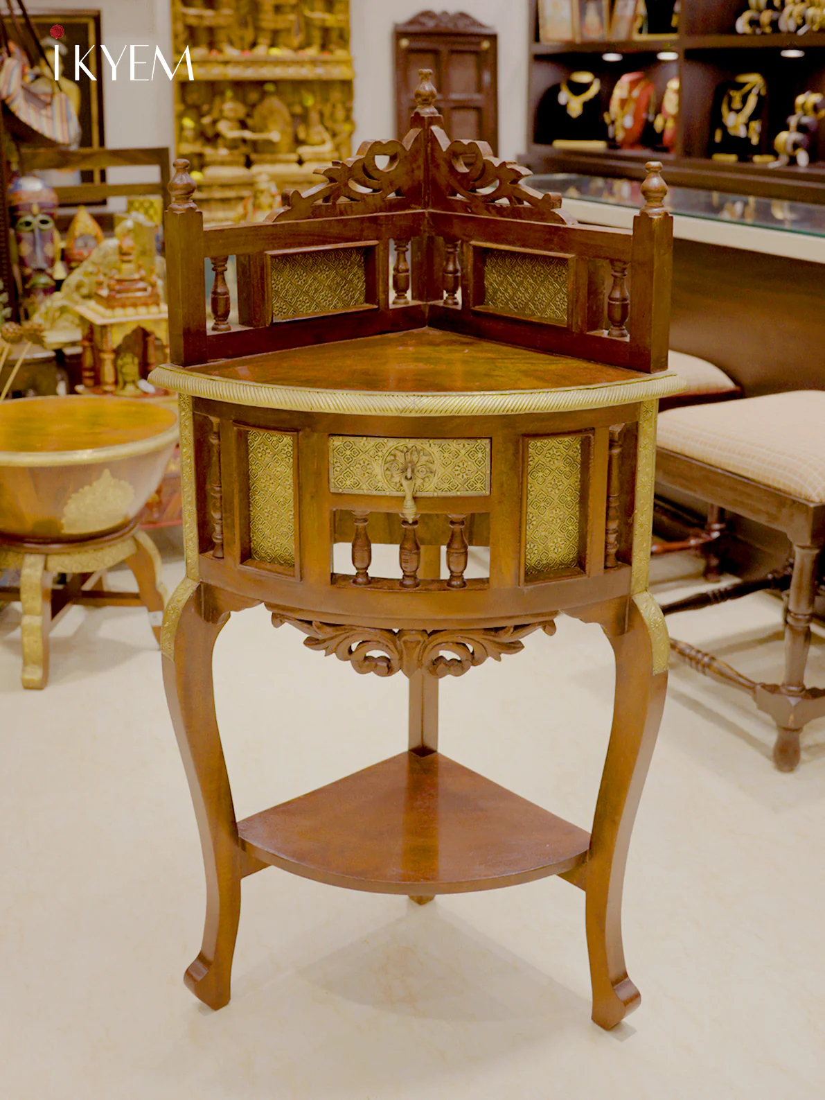 Intricately Carved Corner Table With Brass Accents